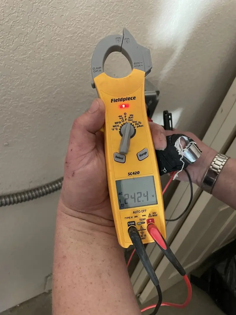 Voltage testing with clamp meter during Whole House Surge Protector in Woodbridge